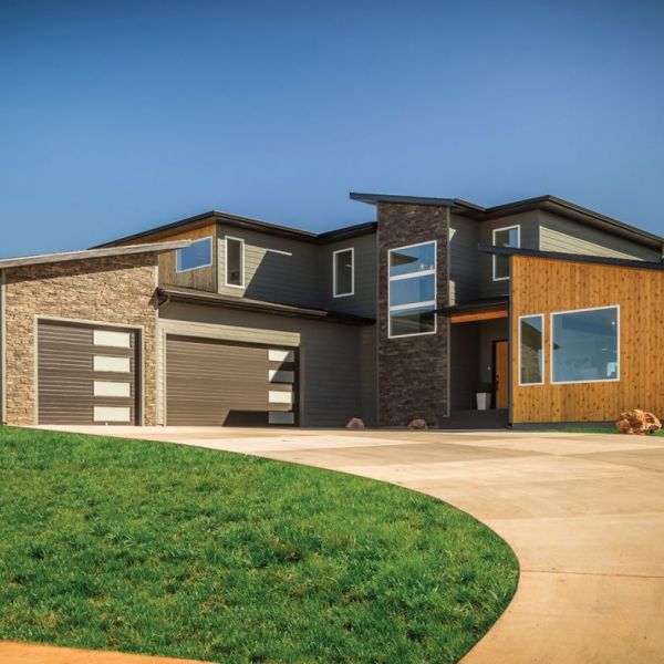 Tamko Roof in Rustic Slate with Smart Side in Smokey Ash accented with 1 x 6 Cedar tongue & groove and Eldorado Stone